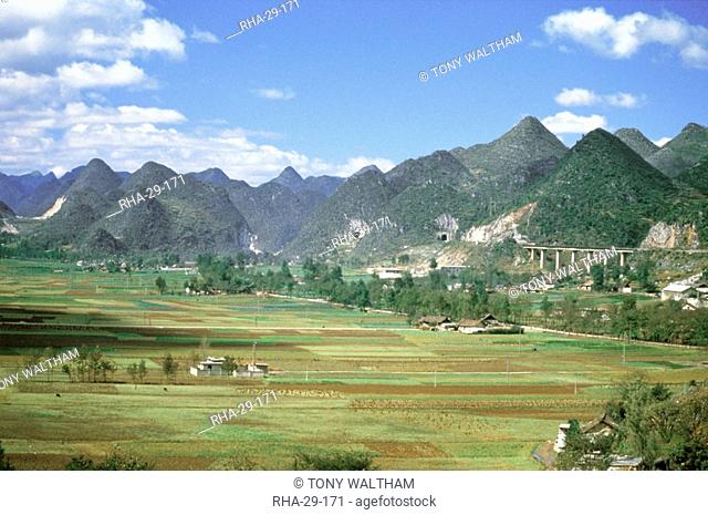 Conical limestone hills and Shanghai to Kunming Railway, Guilin, Shuicheng, Guizhou, China, Asia