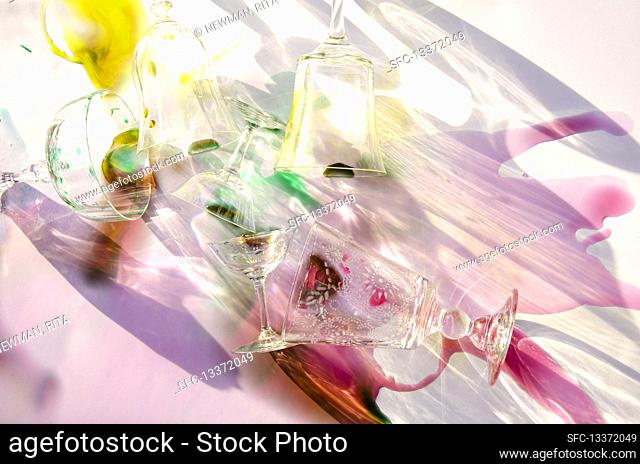 Glasses and spilled colorful liquids