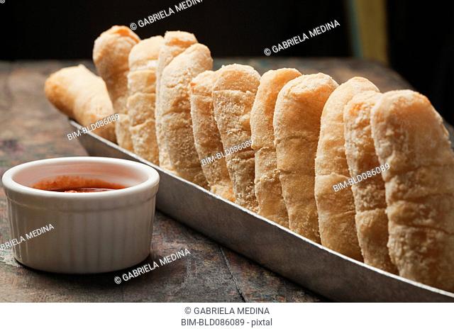 Bread in basket and dipping sauce