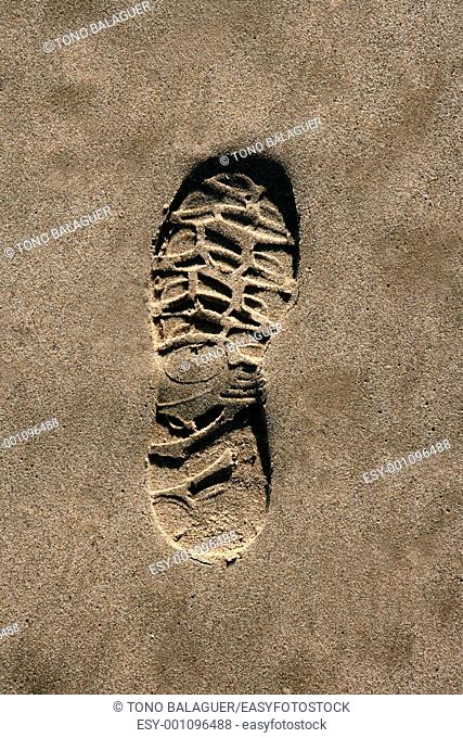 footprint shoe on beach brown sand texture print high view