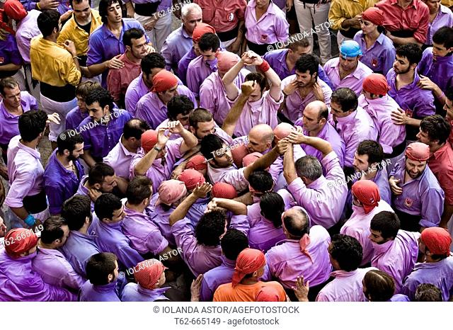 'Castellers' building human towers, a Catalan tradition. Barcelona province, Catalonia, Spain