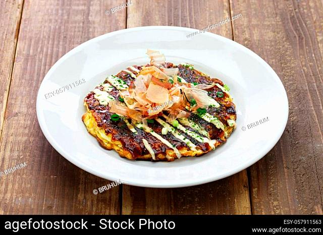 Okonomiyaki is a Japanese savory pancake containing a variety of ingredients