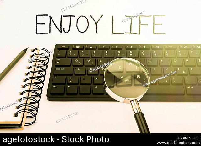 Text sign showing Enjoy Life, Business overview Any thing, place, food or person, that makes you relax and happy Computer Keyboard And Symbol