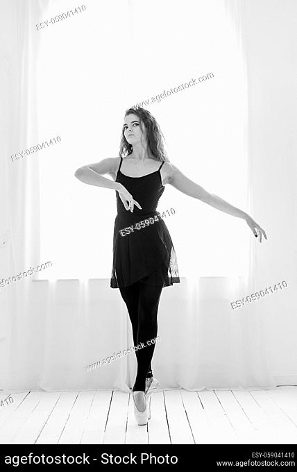 Portrait of a beautiful girl ballerina. Black and white photo. BW