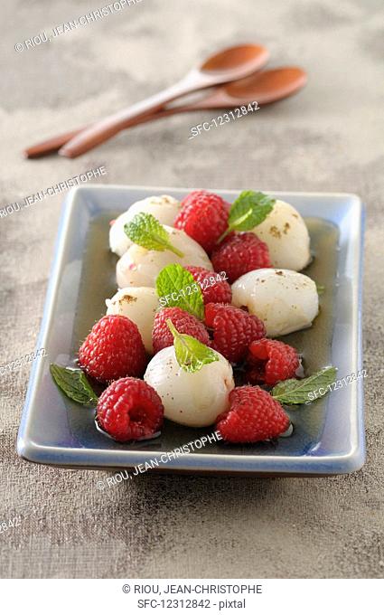 Litchis and raspberries in champagne