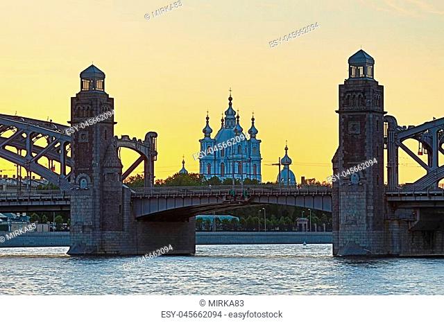View on the Bolsheokhtinsky or Peter the Great Bridge across the Neva River and Smolny Cathedral in Saint Petersburg, Russia in the evening or white night