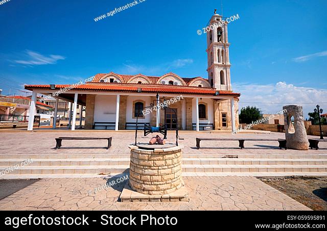 The view of the well on the square in front of the church dedicated to the Apostle and Evangelist Lucas in Kolossi village. Limassol District. Cyprus