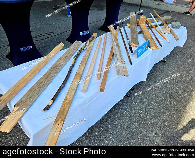 17 September 2023, Baden-Württemberg, Stuttgart: Sticks and battens sighted by the police lie on a table before the press conference on the riots at an Eritrea...