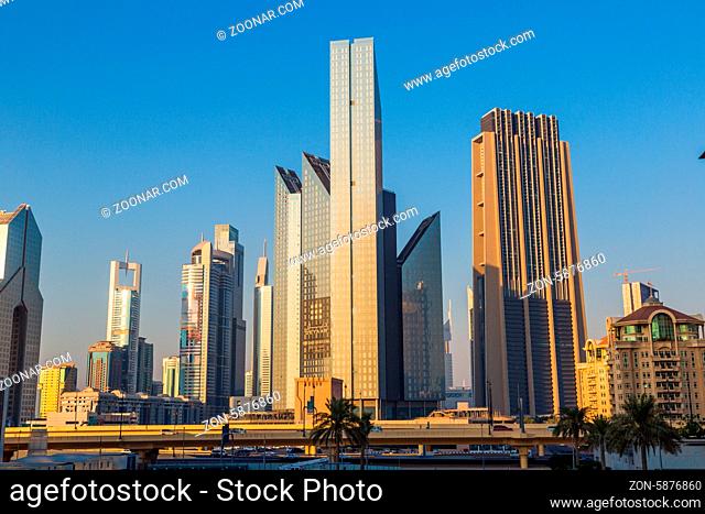 DUBAI, UAE - NOVEMBER 13: Modern skyscrapers in Dubai (emirate and city), UAE. Dubai now boasts more completed skyscrapers higher than 0, 8 - 0
