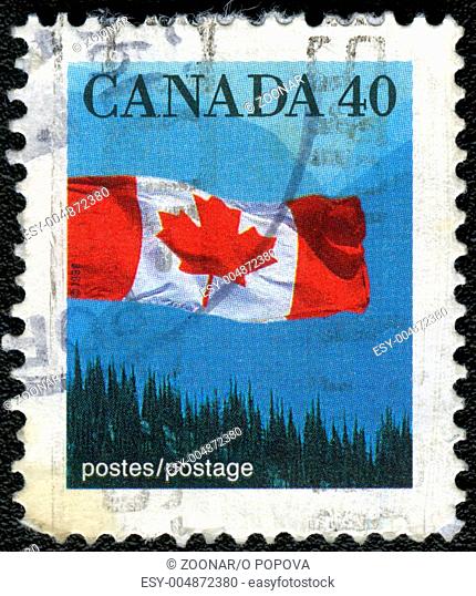 CANADA - 1990: A stamp printed in Canada shows image of the Canadian flag, 1990