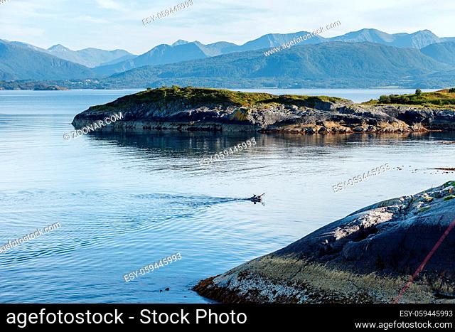 fisher swimming for fish in Northern sea. outdoor shot in Norway. copy space