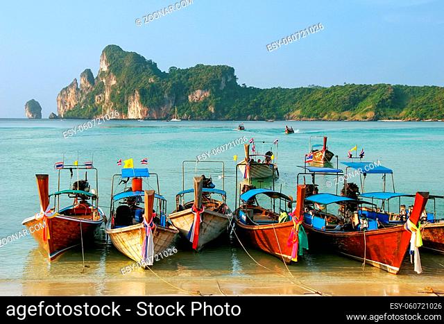 Longtail boats anchored at Ao Loh Dalum beach on Phi Phi Don Island, Krabi Province, Thailand. Koh Phi Phi Don is part of a marine national park