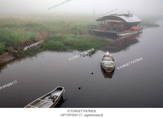 CANOES IN THE MORNING MIST, JAL VOYAGES FLOATING ECO LODGE IN THE NATURE RESERVE OF THE MARSHES OF KAW, ROURA, FRENCH GUIANA, OVERSEAS DEPARTMENT, SOUTH AMERICA