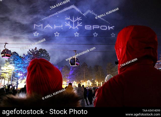RUSSIA, ALTAI REPUBLIC - DECEMBER 2, 2023: A drone show at the opening of an alpine skiing season at the Manzherok year-round ski resort located at the foot of...