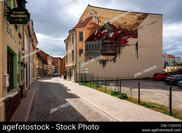 STENDAL, GERMANY - APRIL 24, 2021: Houses and buildings on the streets in the old town. Hansestadt Stendal is a medieval town in Saxony-Anhalt state