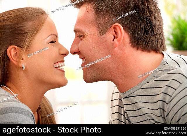 Loving couple laughing at each other in closeup