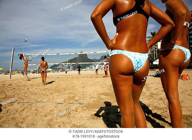Women playing volleyball on Ipanema beach, Rio de Janeiro, Brazil