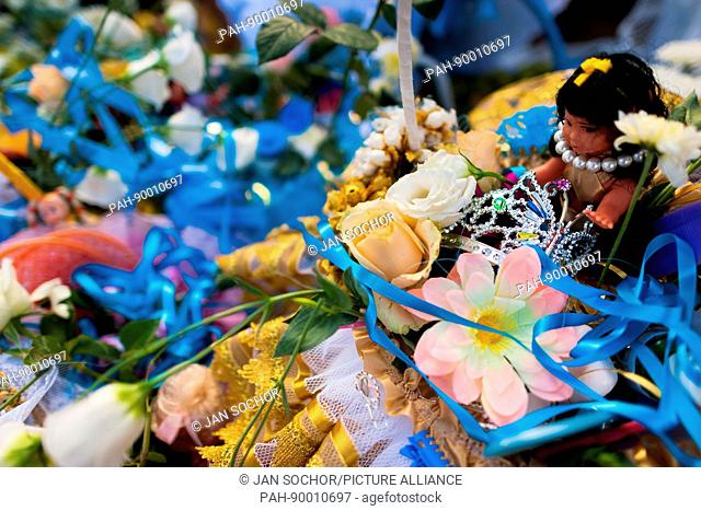 A basket of flowers and jewelry offered as a gift during the celebration of Yemanya, the goddess of the sea, in Salvador, Bahia, Brazil, 2 February 2012