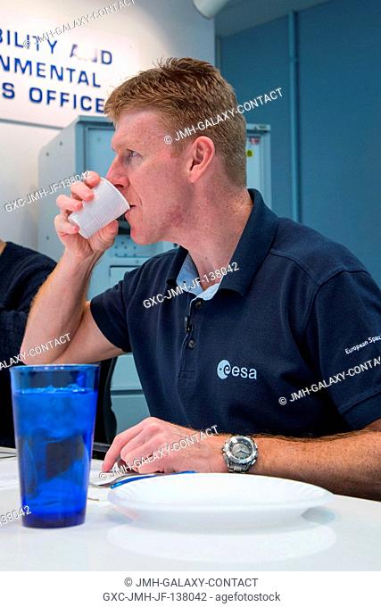 European Space Agency astronaut Timothy Peake, Expedition 4546 flight engineer, participates in a food tasting session in the Habitability and Environmental...