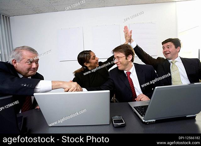 View of business people celebrating in an office