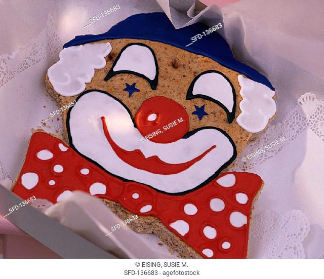 Baked clown's face in nut dough with coloured icing (2)
