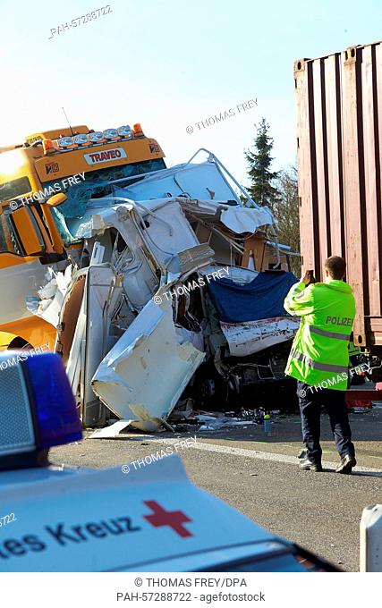 The wreck of a motorhome between two trucks after an accident on the A61 motorway near Boppard, Germany, 9 April 2015. According to police