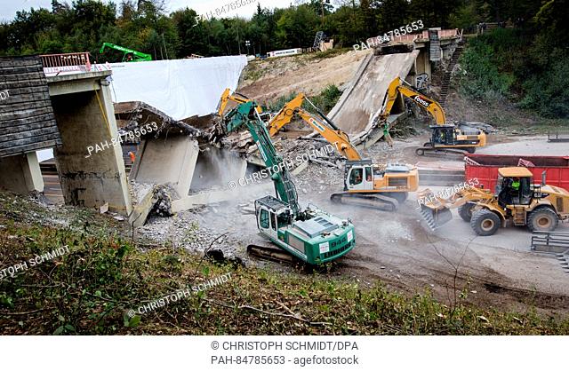 Excavators clear the remains of the demolished footbridge 'Rotes Steigle' over highway A8 near Sindelfingen, Germany, 15 October 2016