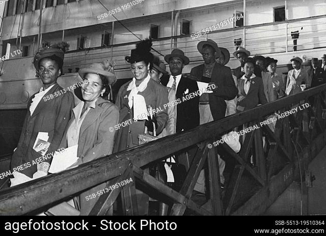 West Indians Arrive In England -- Members of a party of 700 Jamaicans coming ashore from the Dutch liner ""Sibajak"" at Southampton, from New York