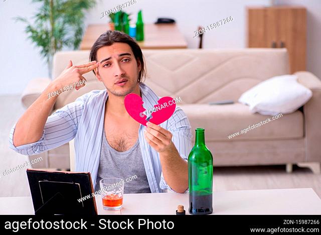 Male alcoholic in unrequited love concept
