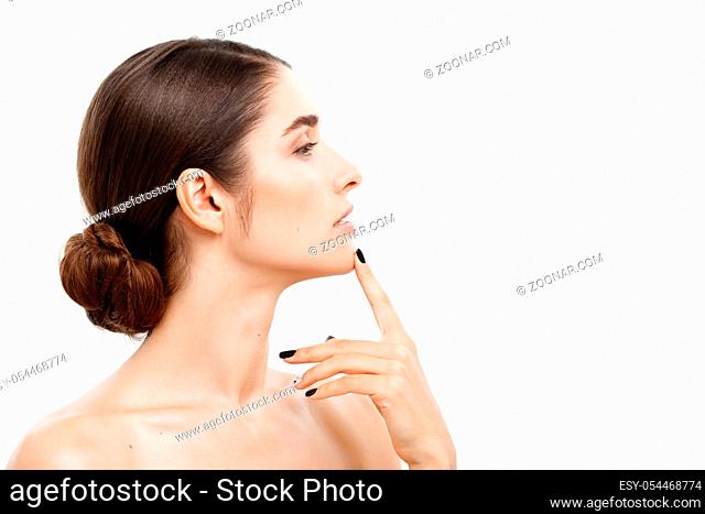Beauty Skin Care Concept - Beautiful caucasian woman face portrait touching her chin with finger shocked and worried with acne isolated on white