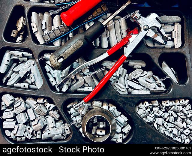 Tire balancing oil and necessary tools. (CTK Photo/Tomas Pekny)