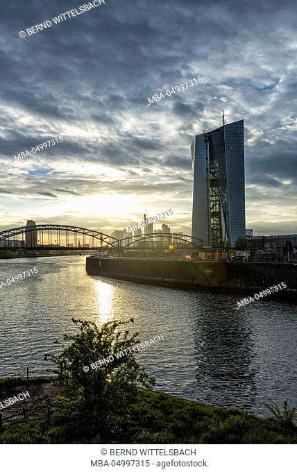 Germany, Hesse, Frankfurt am Main, European central bank with skyline and east harbour at sundown