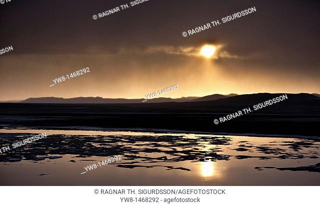 Sunset over glacial landscape, ash filled from the Grimsvotn volcanic eruption, Iceland  The eruption began on May 21, 2011 spewing tons of ash
