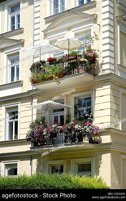 germany, bavaria, munich, town house, old building, wilhelminian style, facade, apartment, balconies with flowers