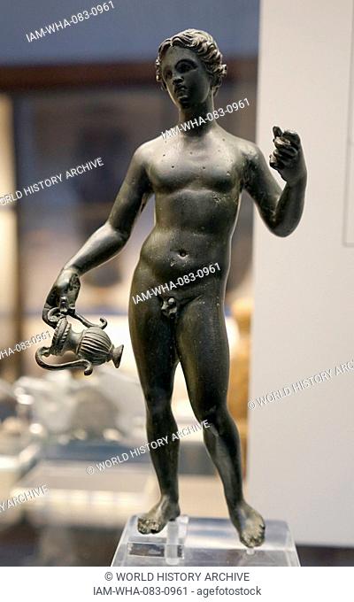 Bronze statuette of Dionysos, the Greek God of wine, holding a Kantharos. Dated 3rd Century BC