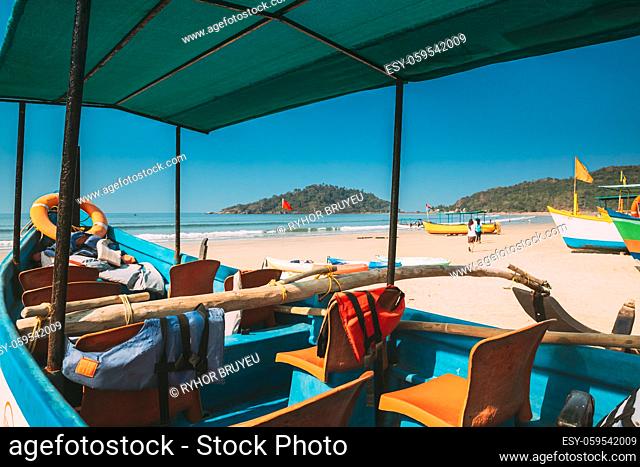 Canacona, Goa, India. Sightseeing Tourist Boat Parked On Famous Palolem Beach In Summer Sunny Day