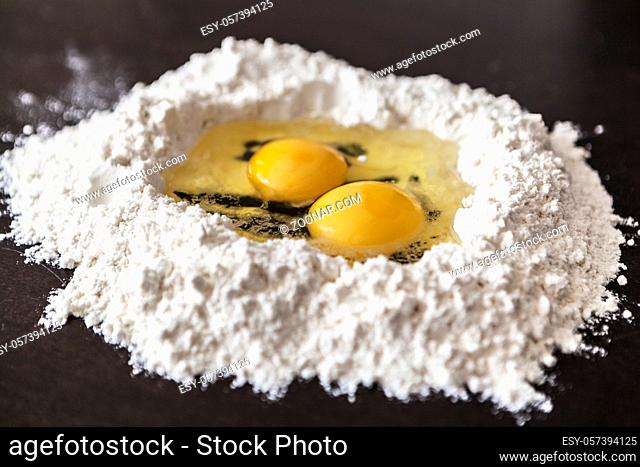 Making homemade pasta with flour and eggs