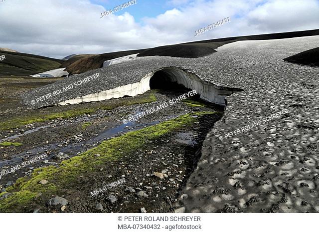 Iceland, Fjallabak, snowfield, old snow covered with volcanic ash in summer, meltwater
