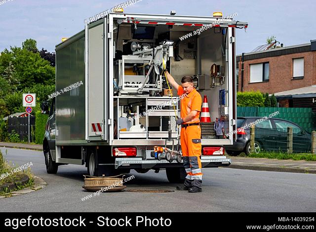 hamm, north rhine-westphalia, germany - tv sewer inspection vehicle, sewer inspection by means of a camera, a trainee, a specialist for pipe