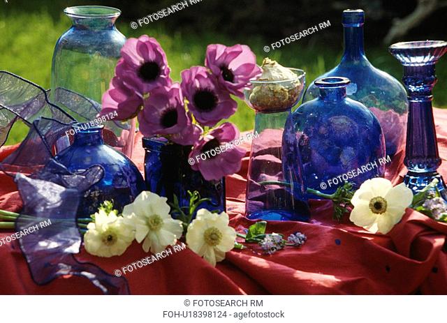 Still-life of blue glass bottles and anemones&13, &10