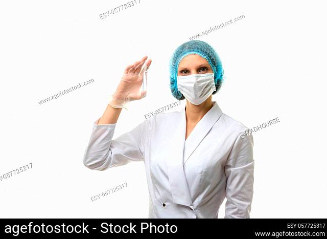 Doctor holding ampoule with medical drug isolated on white background