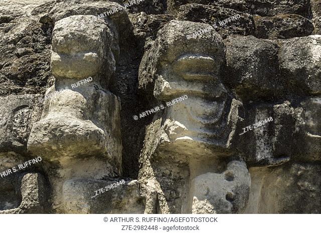 Carved reliefs on the summit staircase of Temple II, Temple of the Masks. Tikal, Guatemala, Central America
