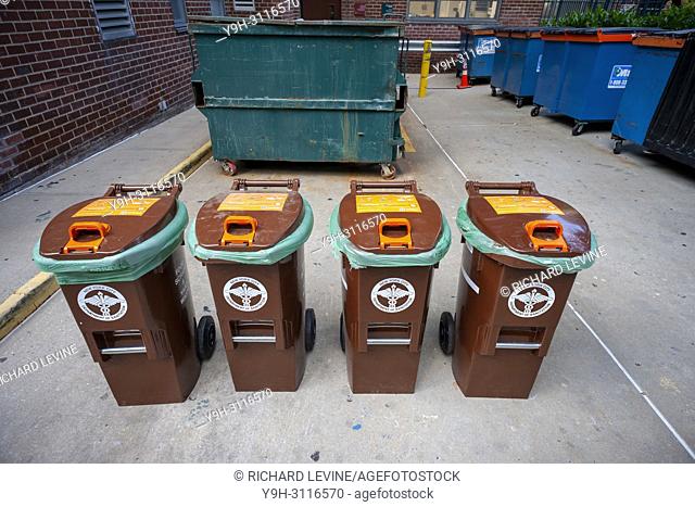 Bins for the New York Dept. of Sanitation Organic Waste Collection program outside of an apartment building in the Chelsea neighborhood of New York on Wednesday