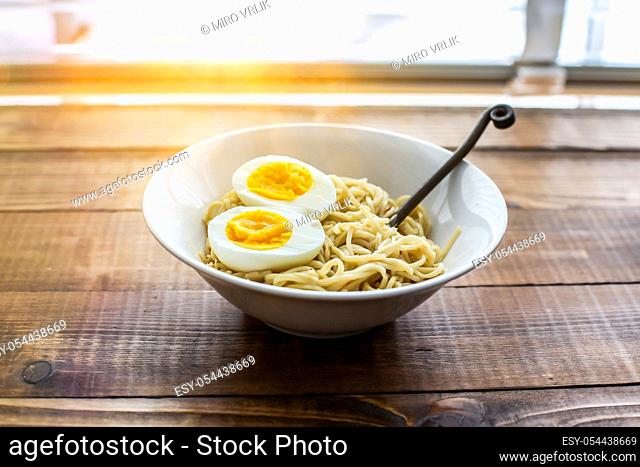 Ramen noodle with eggs and sunbeam from outside