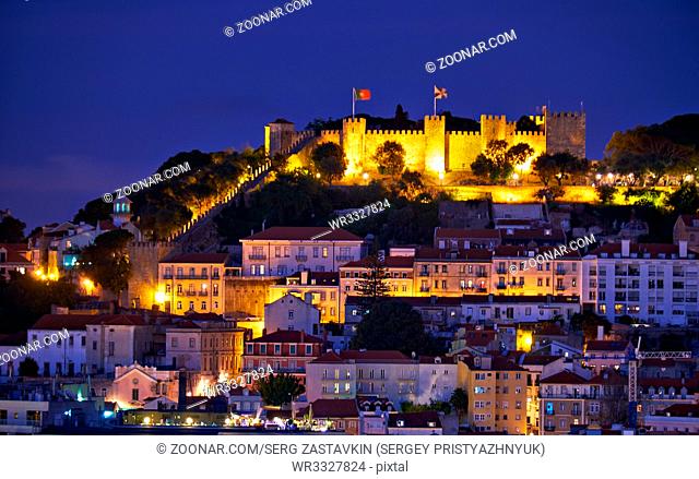 View of Lisbon in the night with St Jorge Castle on the hill