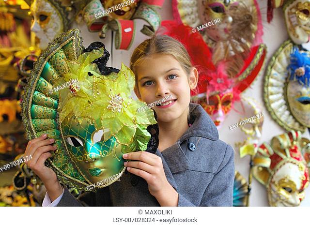 Carnival in Venice, Italy. Portrait of beautiful girl with venetian mask
