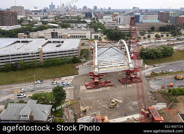 Detroit, Michigan USA - 24 July 2022 - The new Second Avenue bridge is rolled into place across Interstate 94. The 5, 000