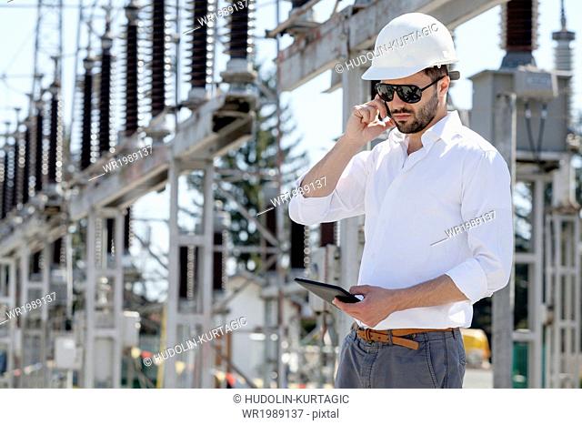 Engineer checking electricity substation