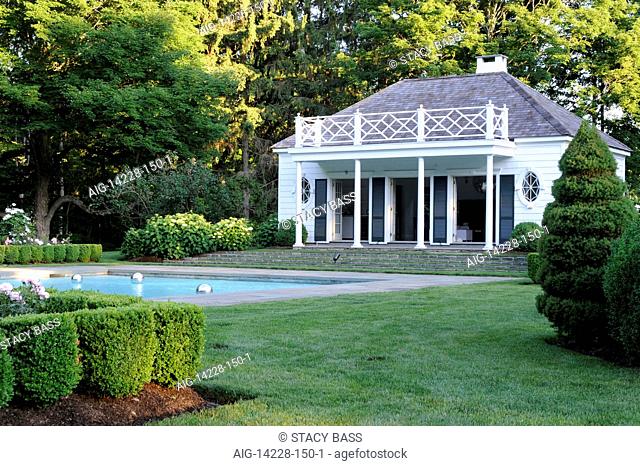 Poolhouse exterior with swimming pool, USA