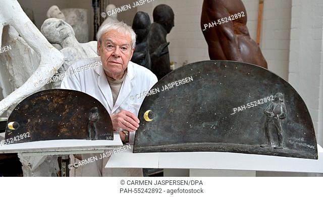 Sculptor Waldemar Otto stands between the moulds for a sculpture of poet Matthias Claudius in his studio in Worpswede, Germany, 14 January 2015